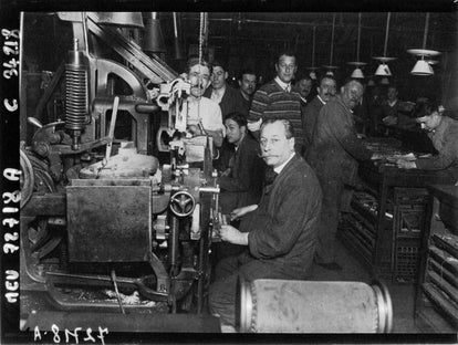 Men working in a factory in France, wearing a Chore Coat