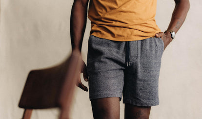 fit model posing in The Apres Short in Navy Linen Tweed