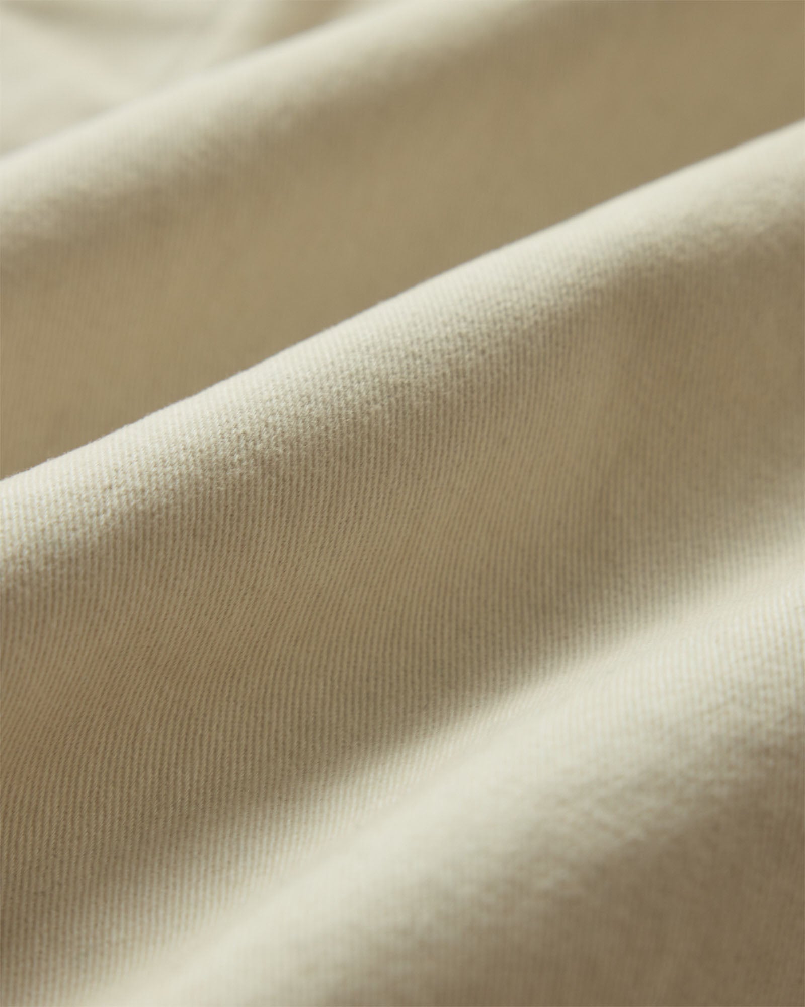 material shot of the fabric on The Apres Short in Organic Aged Stone Foundation Twill, Bottoms by Taylor Stitch
