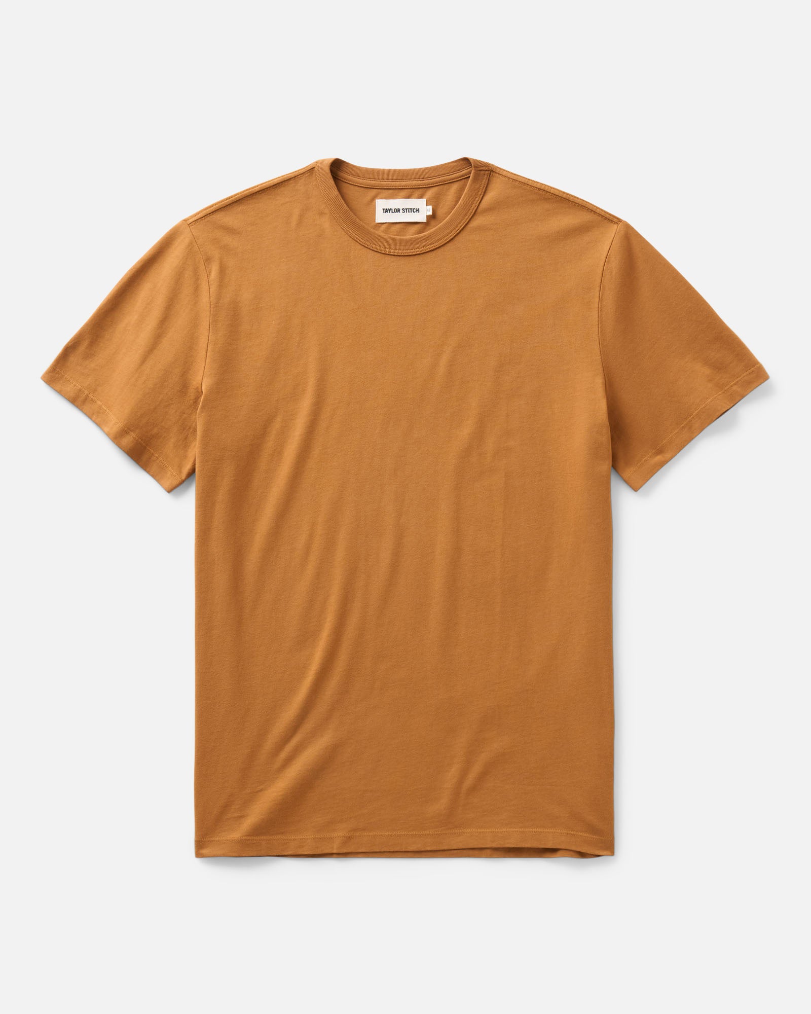 flatlay of The Regenerative Cotton Tee in Saffron, Knits by Taylor Stitch