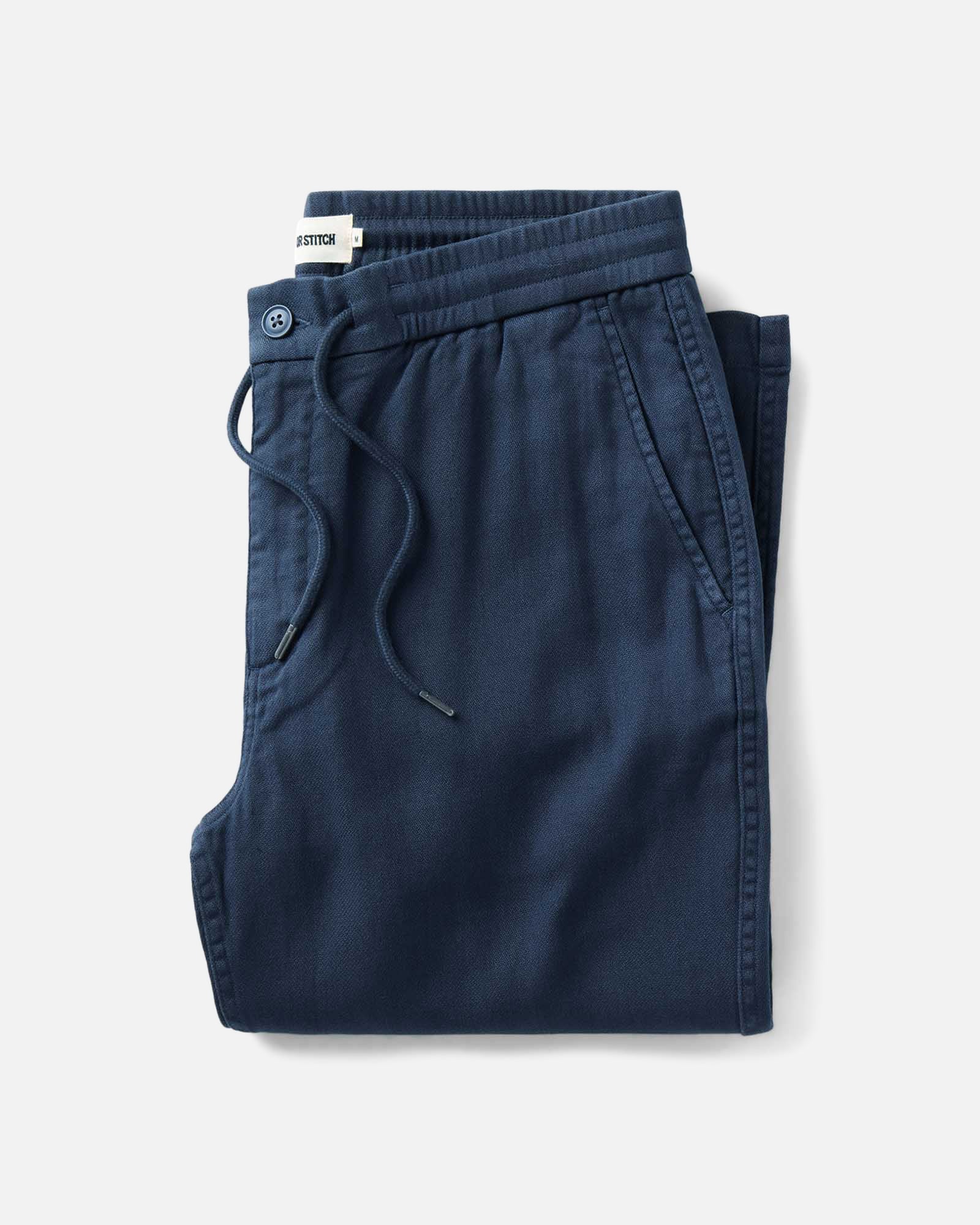 folded flatlay of The Roamer Pant in Navy Broken Twill, Bottoms by Taylor Stitch