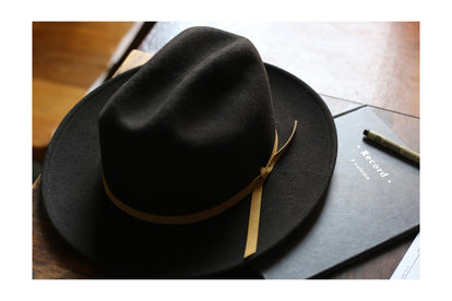 layflat of hat next to journal
