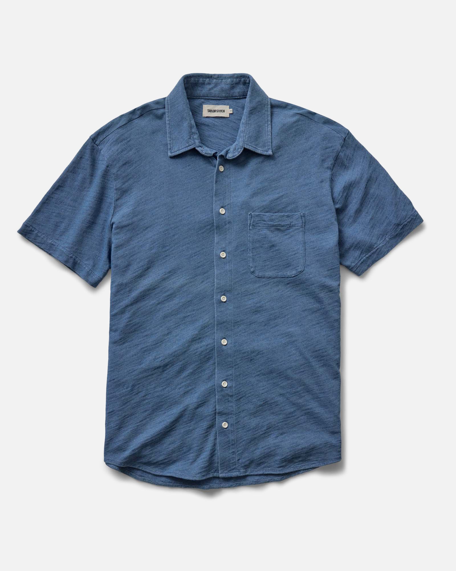 flatlay of The Short Sleeve California in Washed Indigo Slub, Wovens by Taylor Stitch
