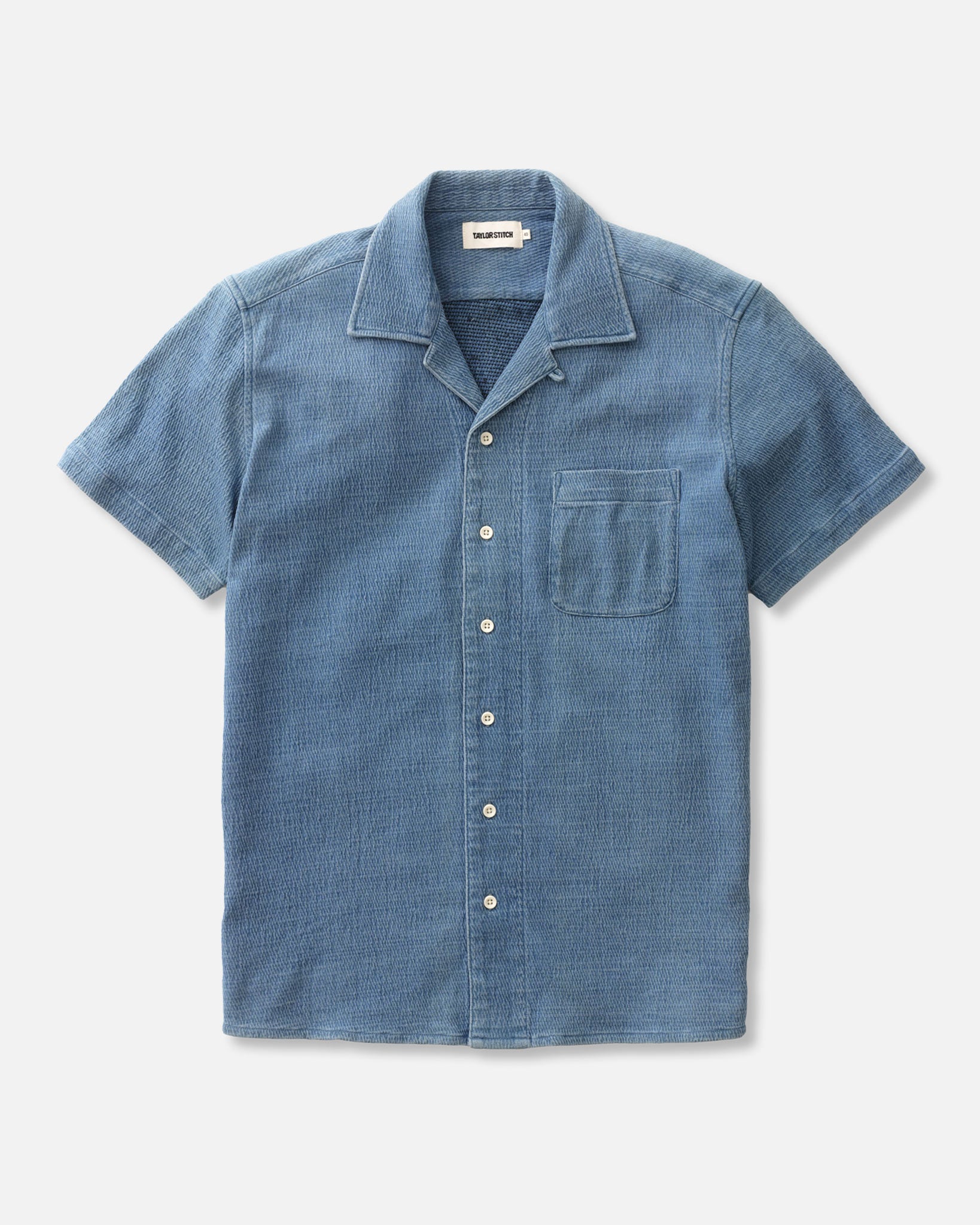 flatlay of The Hawthorne Shirt in Washed Indigo Crepe, Knits by Taylor Stitch