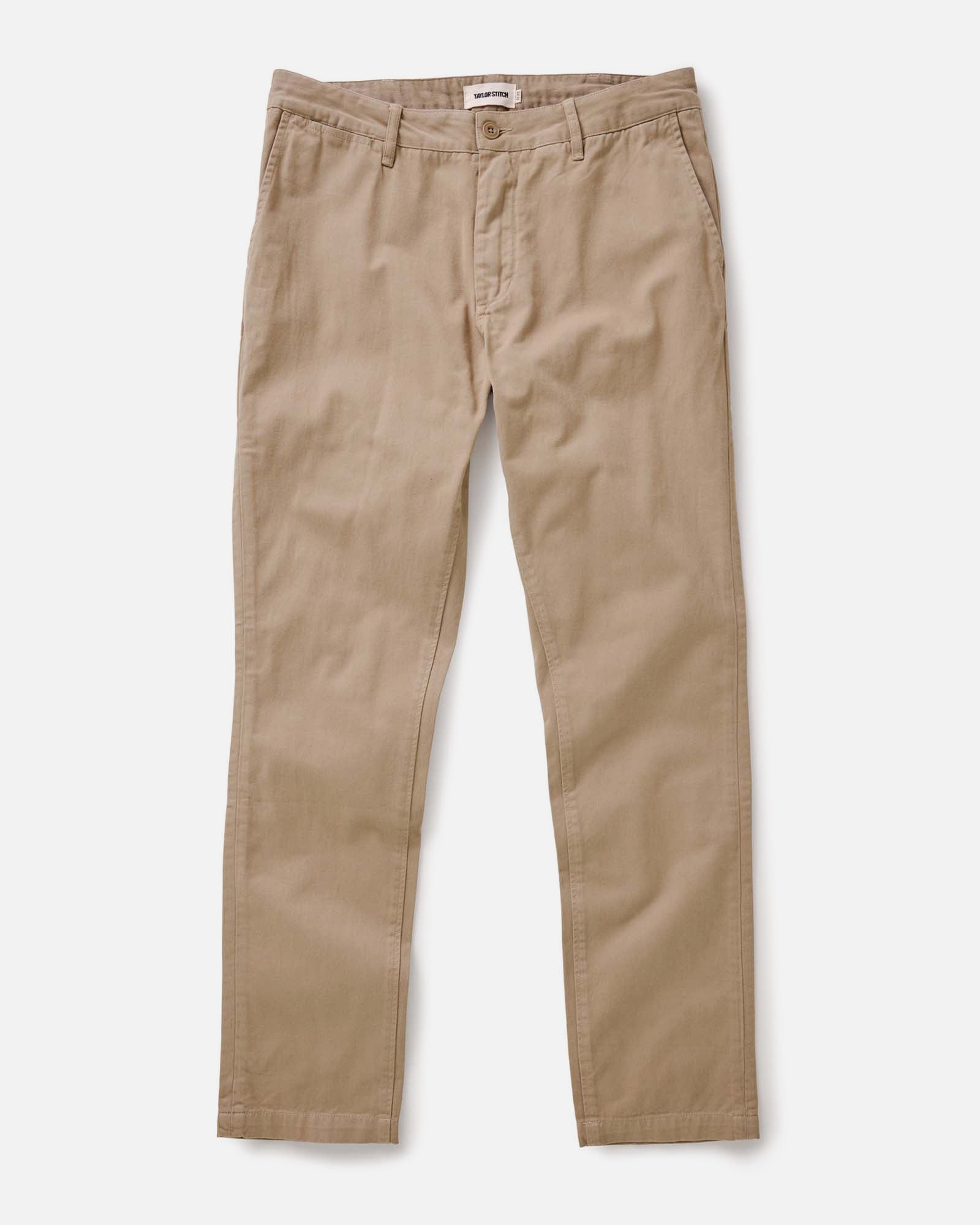 material shot of the back button-through pockets on The Slim Foundation Pant in Organic Khaki, Bottoms by Taylor Stitch