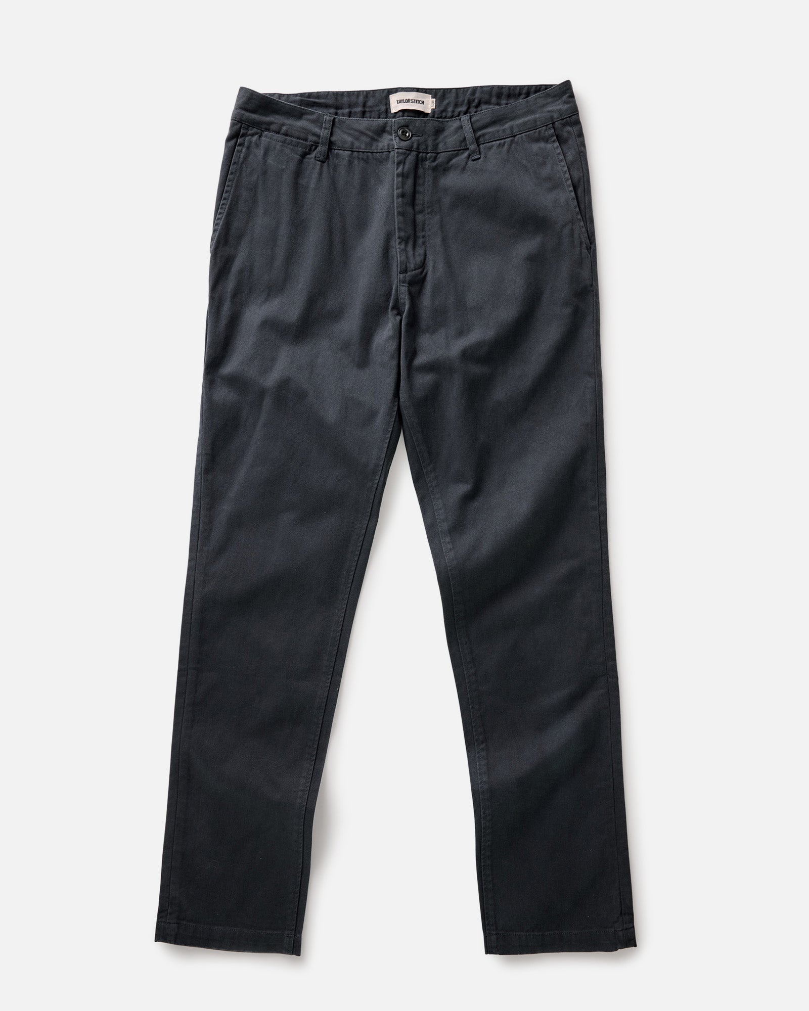 flatlay of The Slim Foundation Pant in Organic Navy, Bottoms by Taylor Stitch