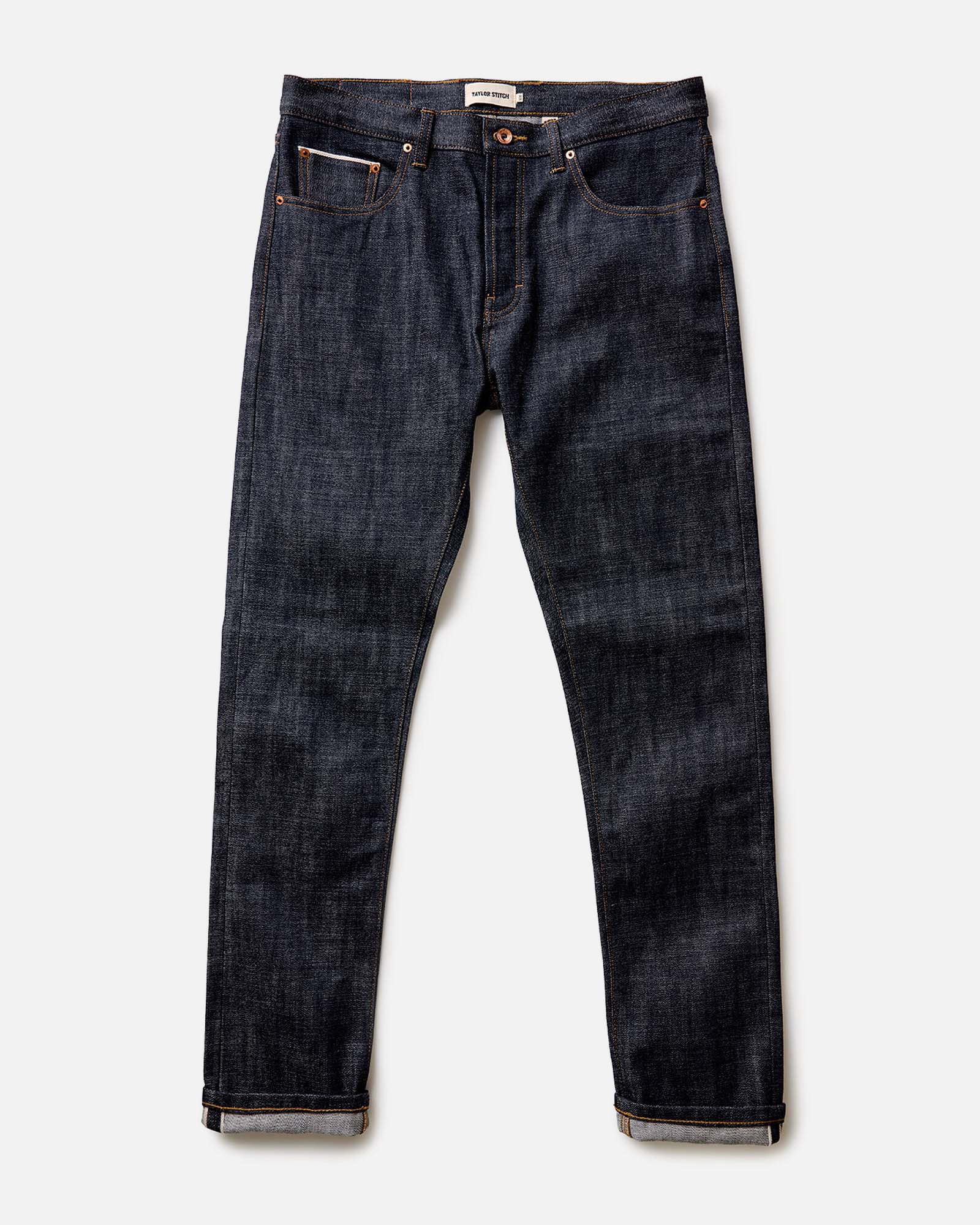 fit model showing off cuffs on The Slim Jean in Rigid Organic Selvedge, Bottoms by Taylor Stitch