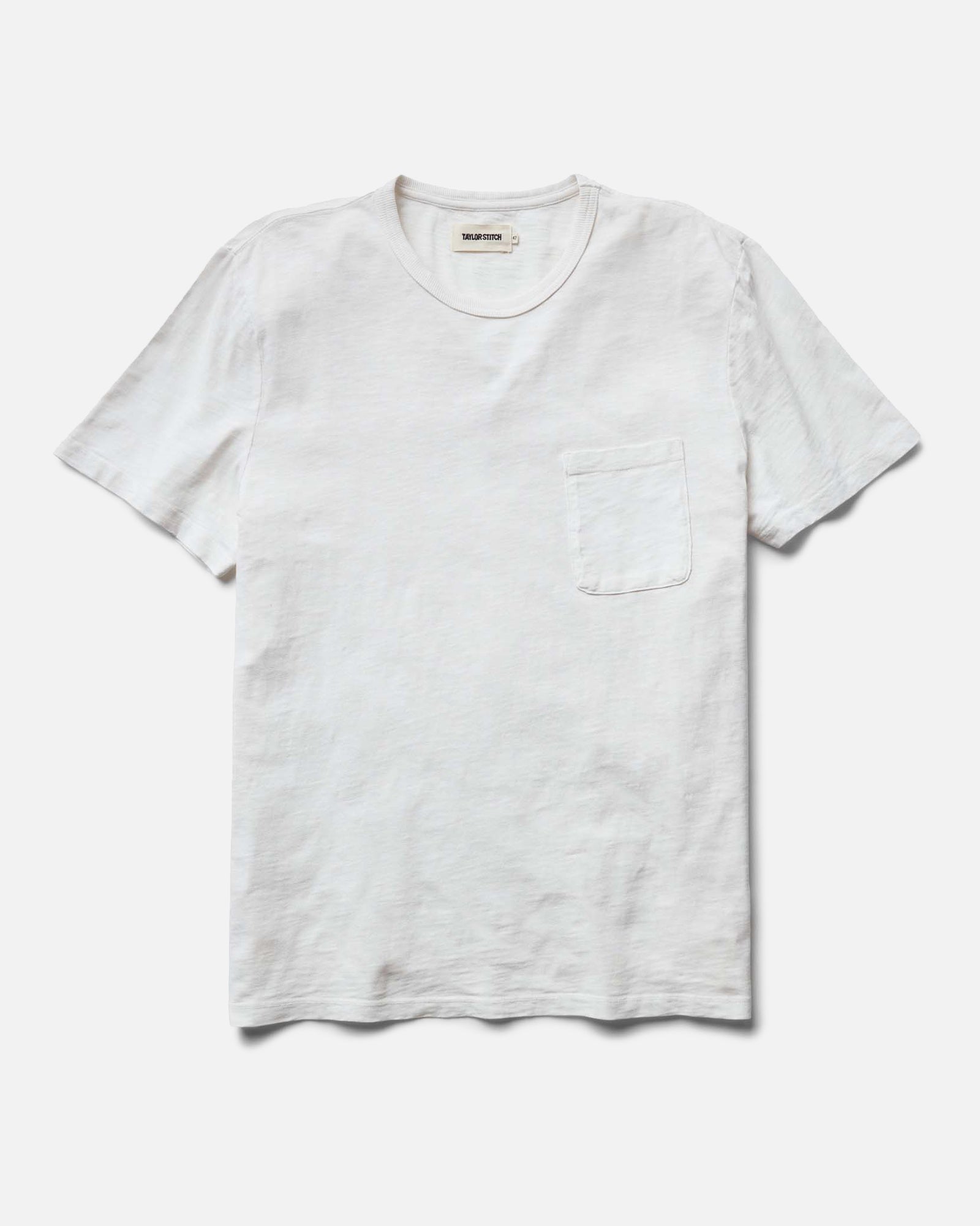 flatlay of The Slub Tee in White, Knits by Taylor Stitch