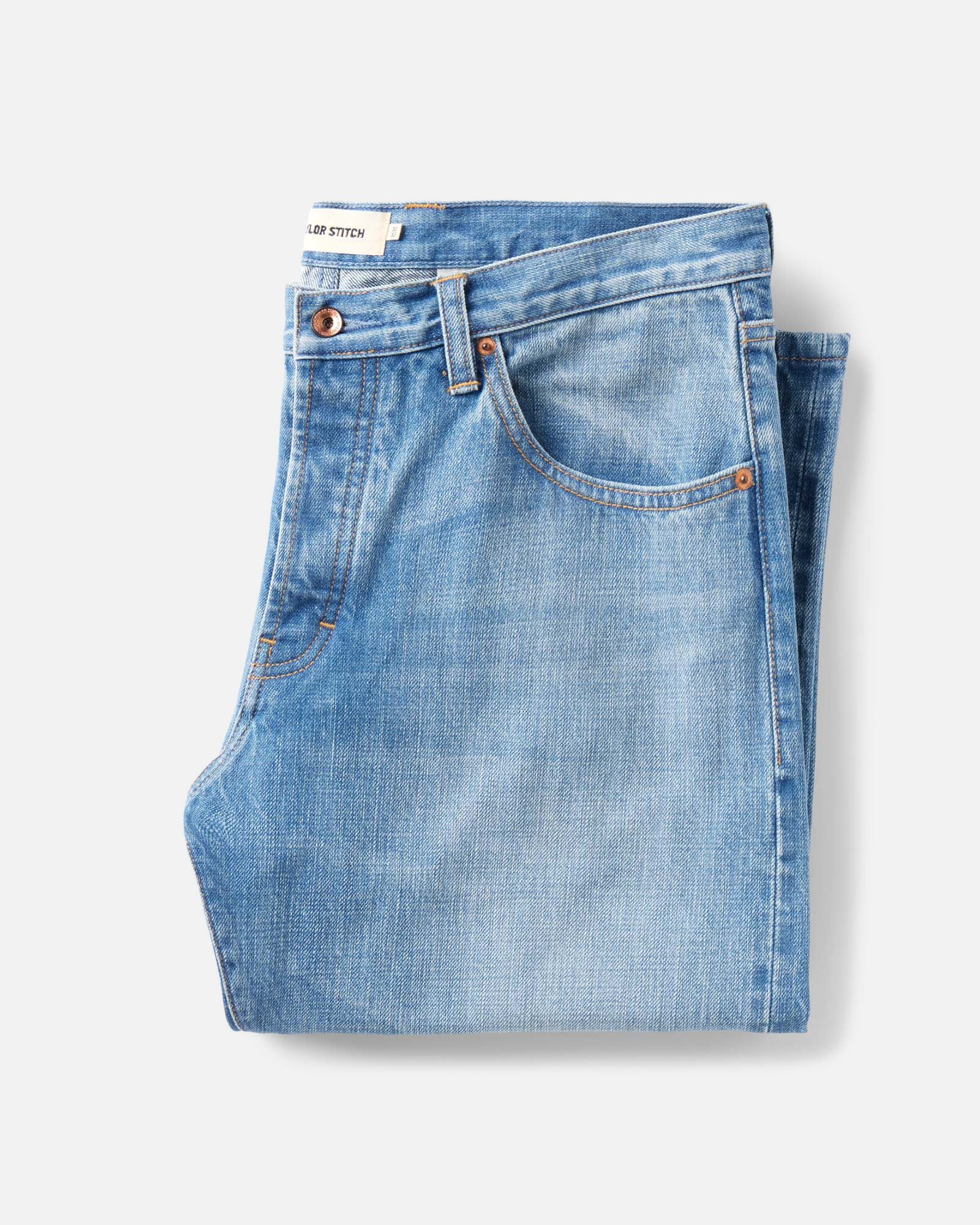 folded flatlay of The Straight Jean in Light Wash Organic Selvedge, Bottoms by Taylor Stitch