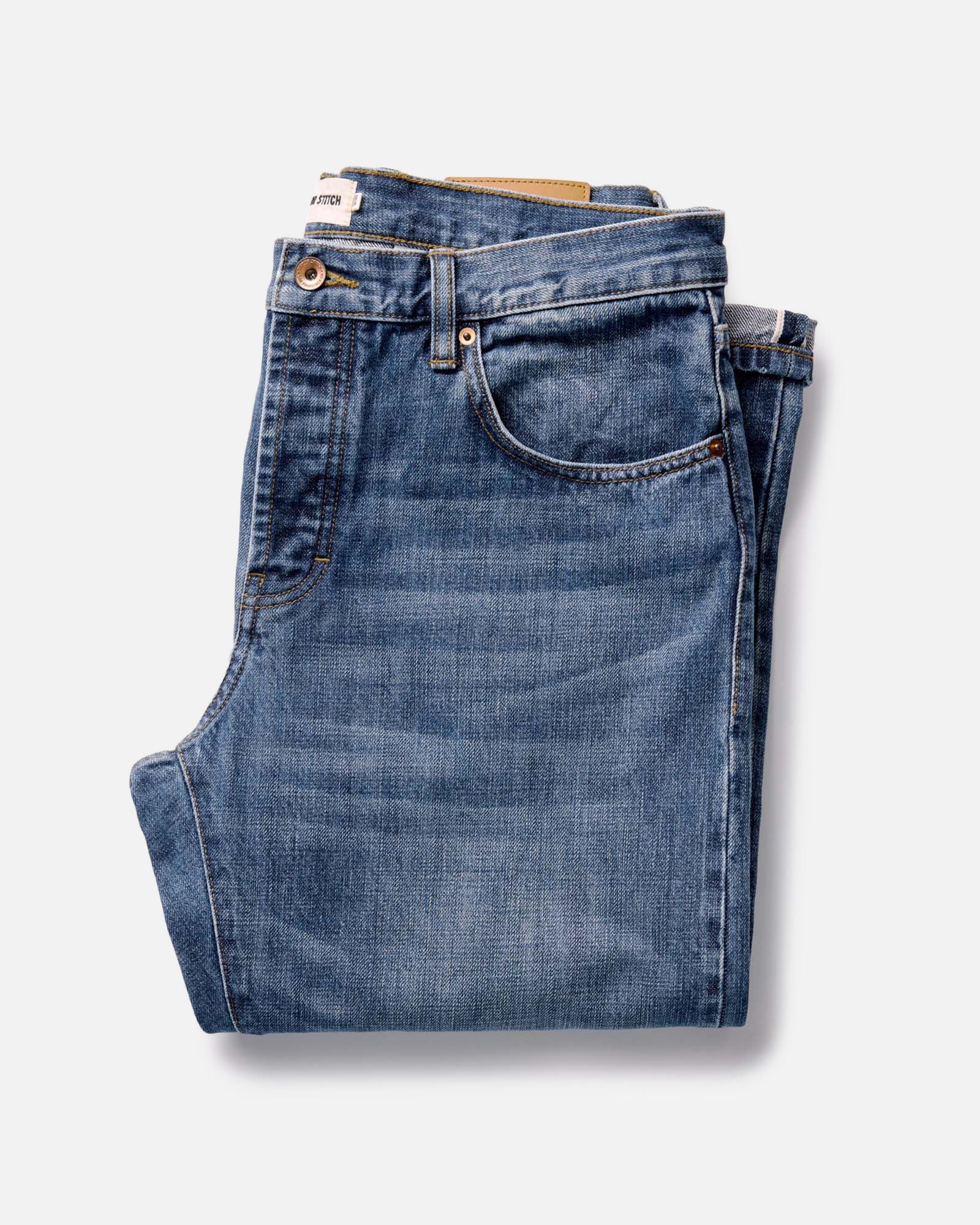 folded flatlay of The Straight Jean in Mid Wash Organic Selvedge, Bottoms by Taylor Stitch