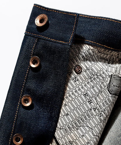 SF map material comprising pockets on interior of jeans.