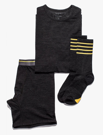 Flatlay of our black merino products: boxers, socks and a tee.