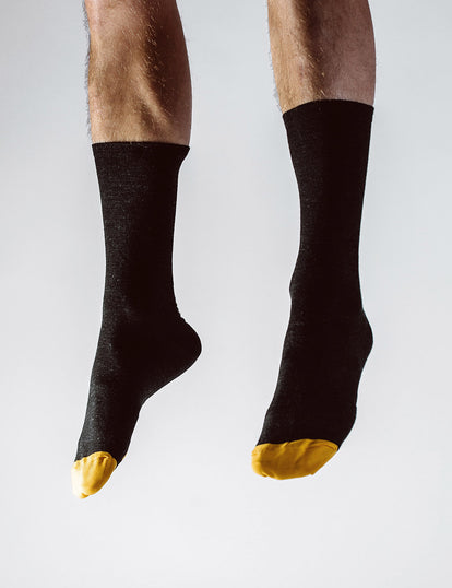 Feet, jumping, wearing our merino socks.