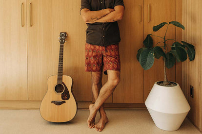 Our guy wearing The Adventure Short in Rust Floral.