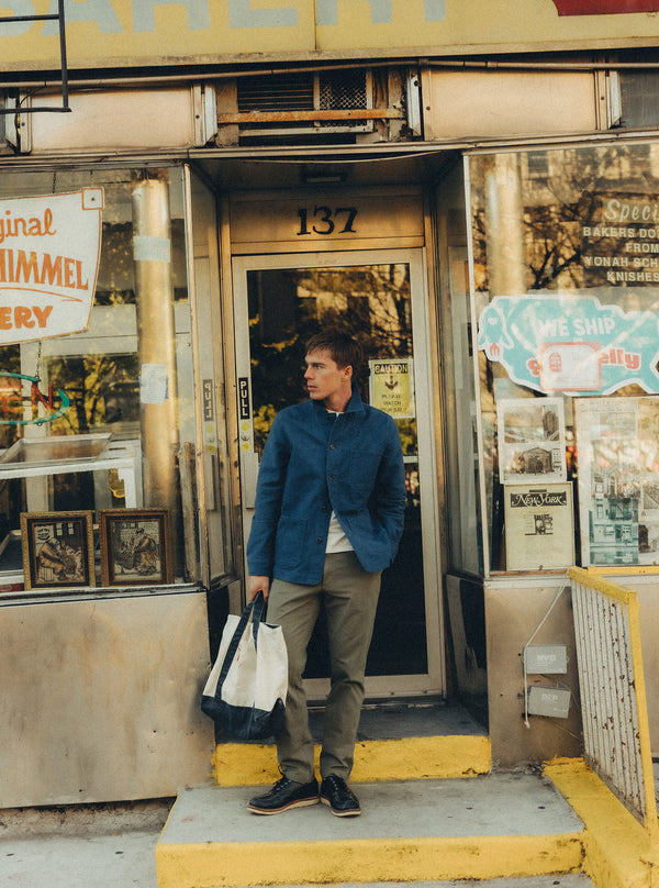 Model wearing the Ojai Jacket in front of a bakery in New York
