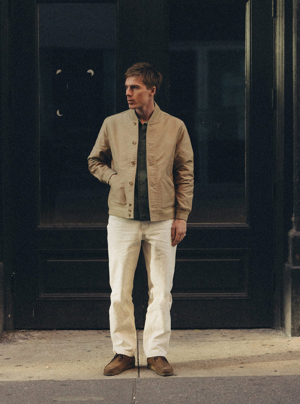Model standing in The Clark Bomber Jacket and Painter Pant in Seeded Natural