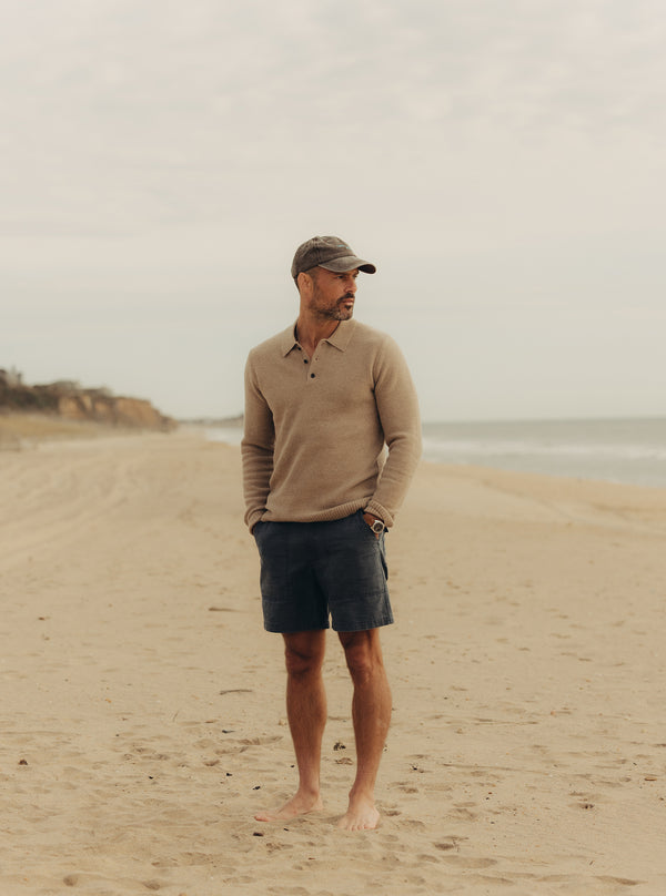 Model standing on the beach, wearing the Newton Sweater Polo