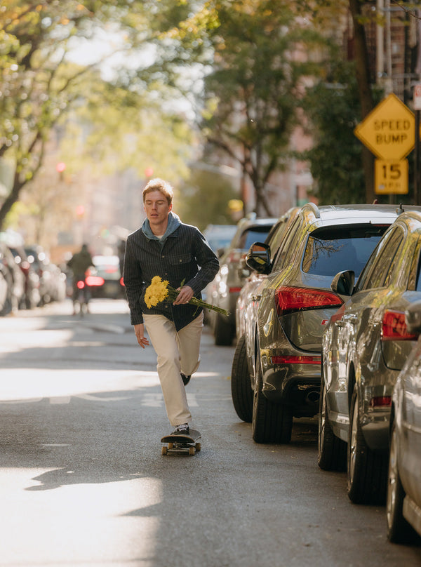 Model skating down the streets of NYC in The Fremont Jacket