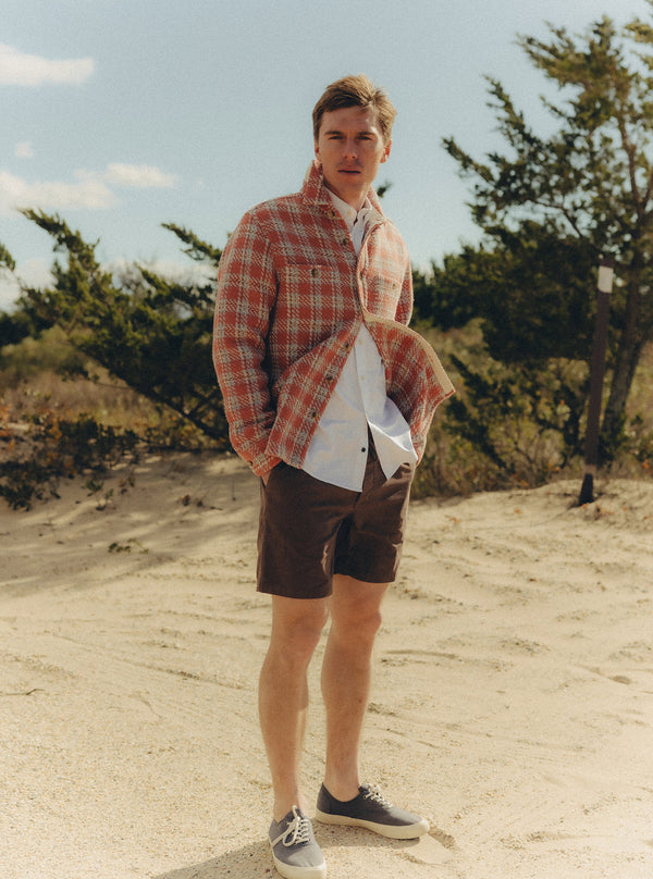 Model standing on the beach in the Cutter Overshirt