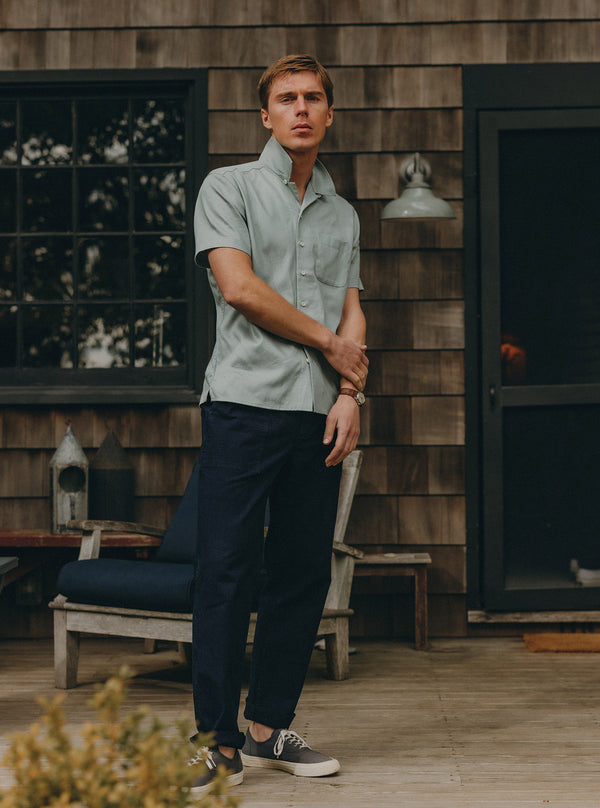 Model standing in front of a cabin