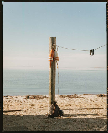 Wooden post on the beach in cape cod