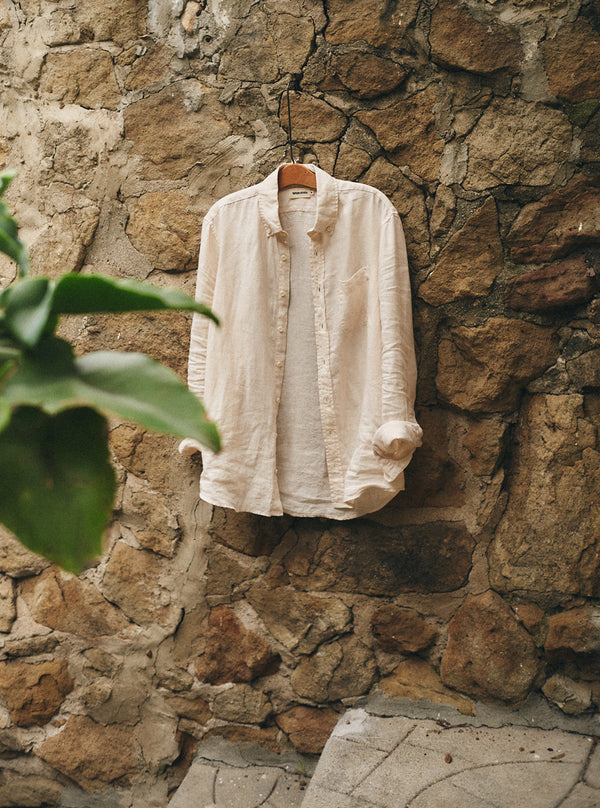 The Jack in Vintage White Linen hanging on a stone wall