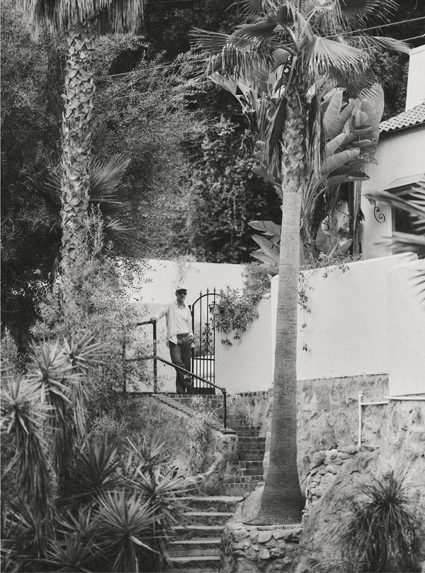 Model standing by an outdoor stairwell in Los Angeles