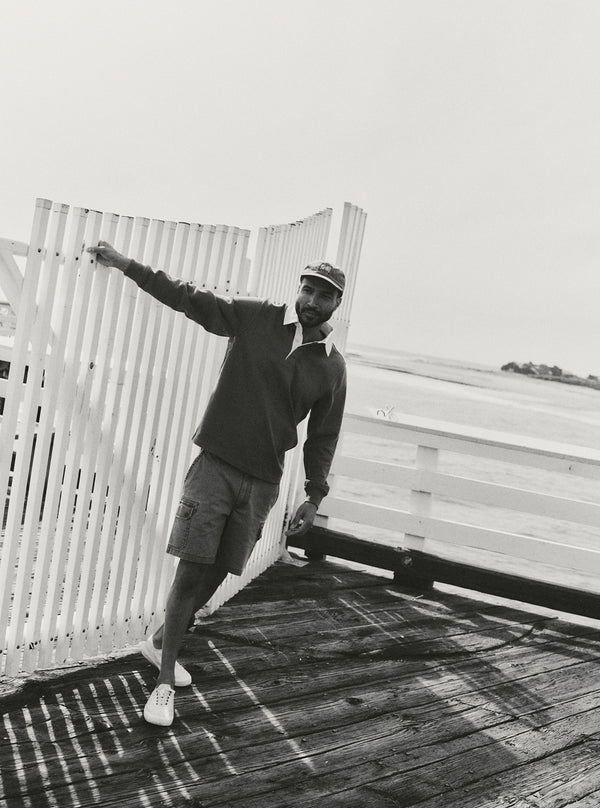 Model standing on the pier in the Rugby Shirt and Scout Short