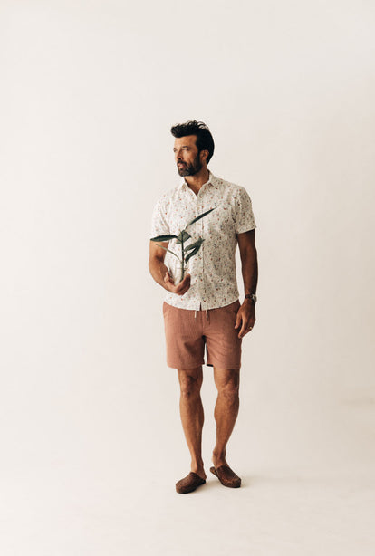 Model wearing The Short Sleeve California in Vintage Botanical and The Apres Short