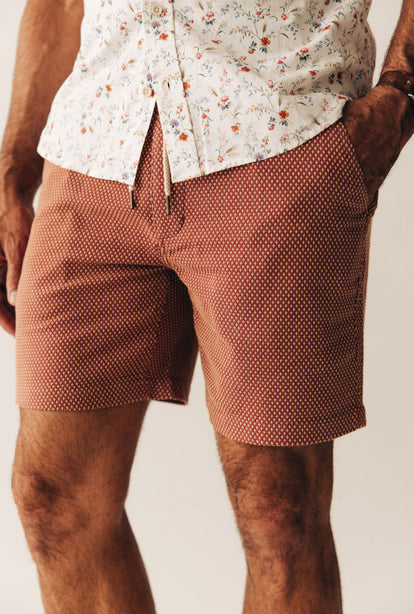 Close up of model wearing The Apres Short in Fired Brick Dobby