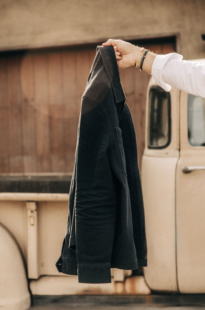 The Station Jacket in Dark Navy, hanging outdoors