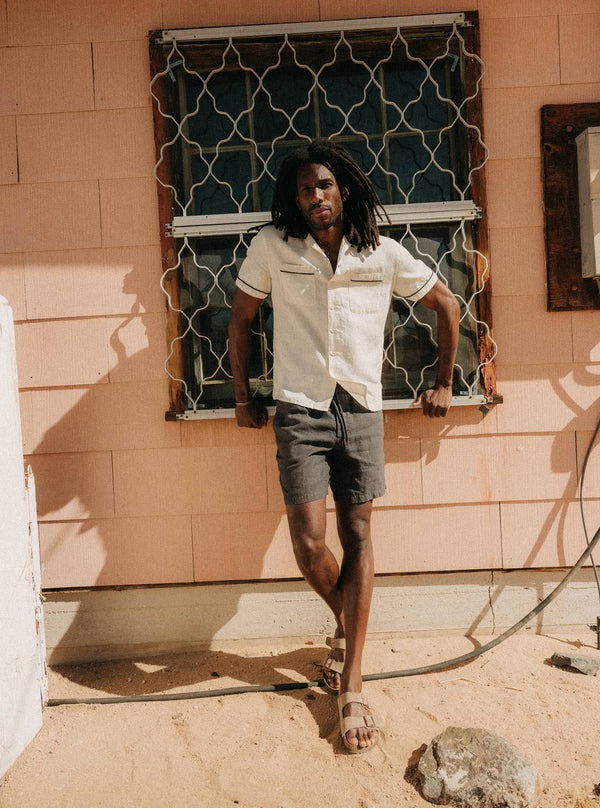 Model wearing The Weber Shirt in Vintage White and The Apres Short in Faded Black Hemp