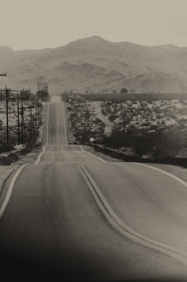 A road paved through the desert in Joshua Tree
