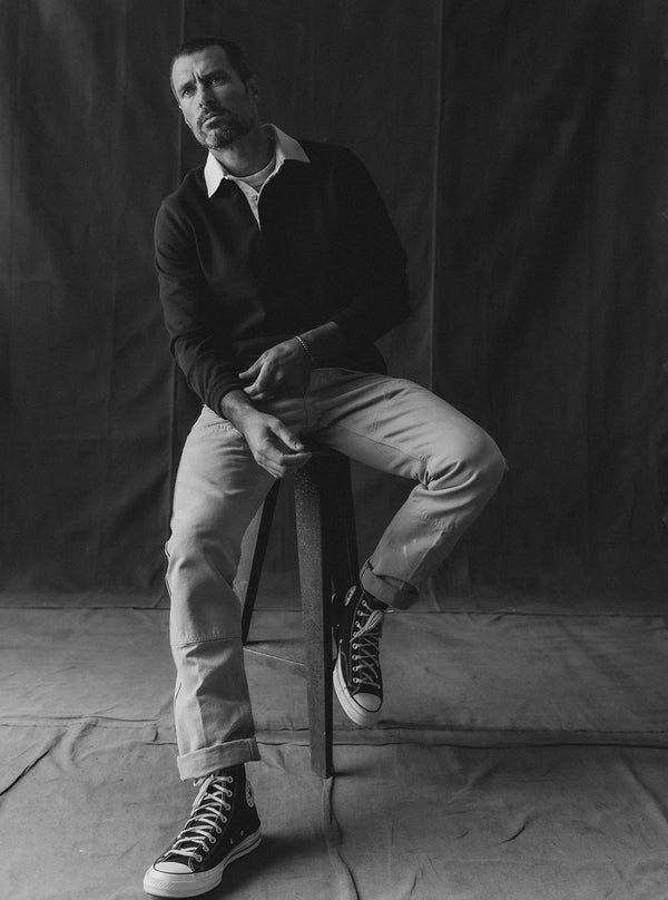 Model sitting on a stool wearing The Rugby Shirt