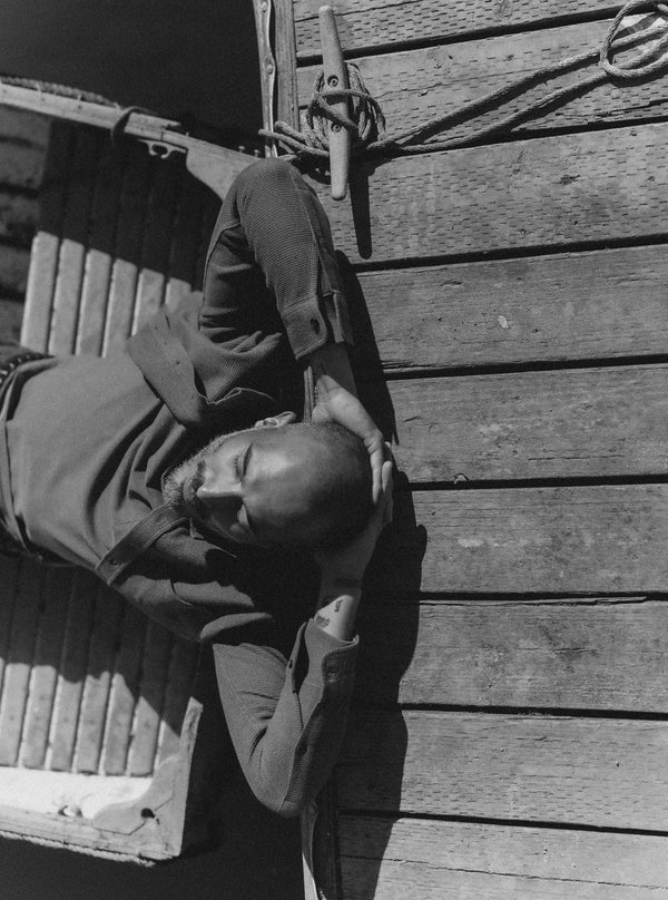 Model leaning against the dock