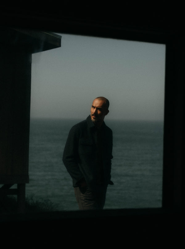 Model standing in front of the sea