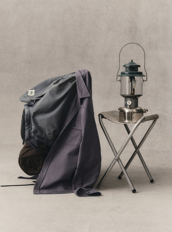 The Yosemite in Dried Plum draped on a backpack