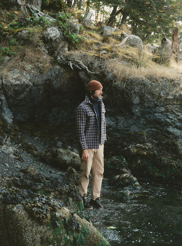 Model standing in a forest, wearing The Maritime Shirt Jacket