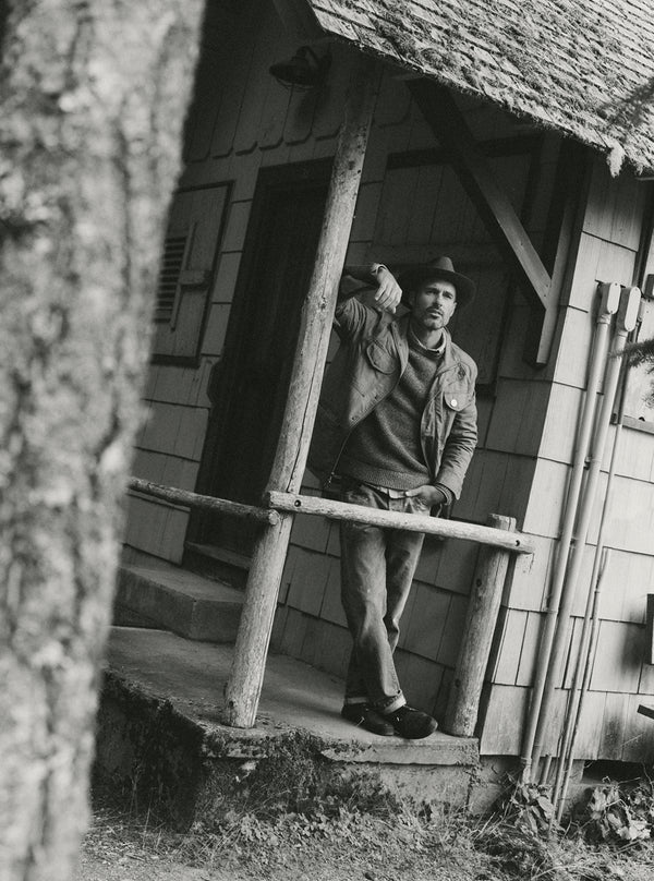 Model standing on the veranda in the Field Jacket