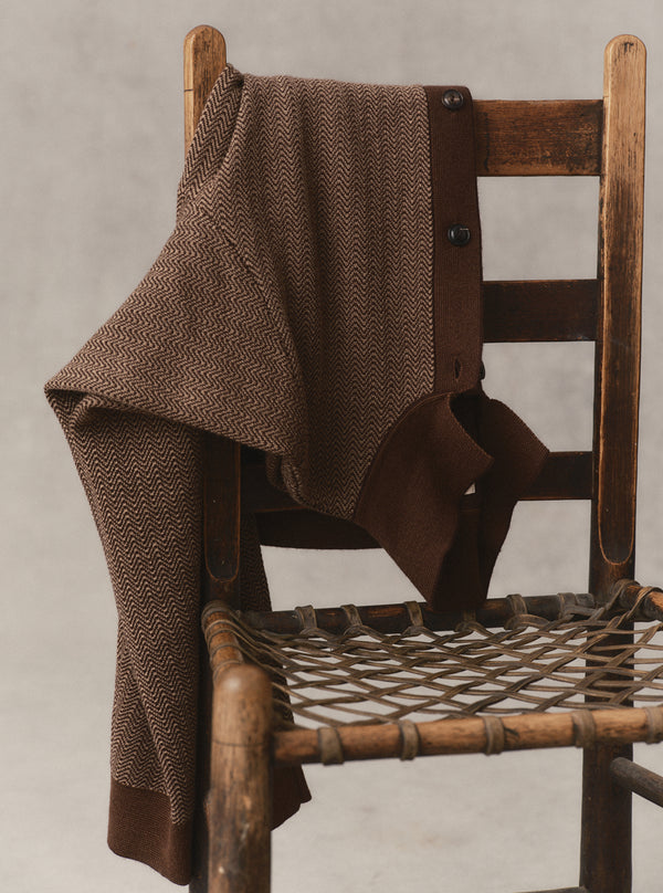 The Miles Sweater Polo draped on a chair