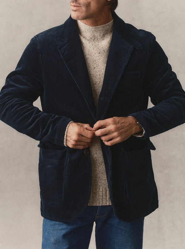 Model buttoning the Riley Sportcoat