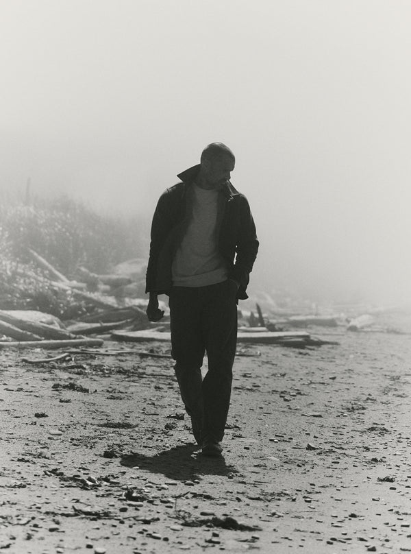 Black and white image of model on the beach