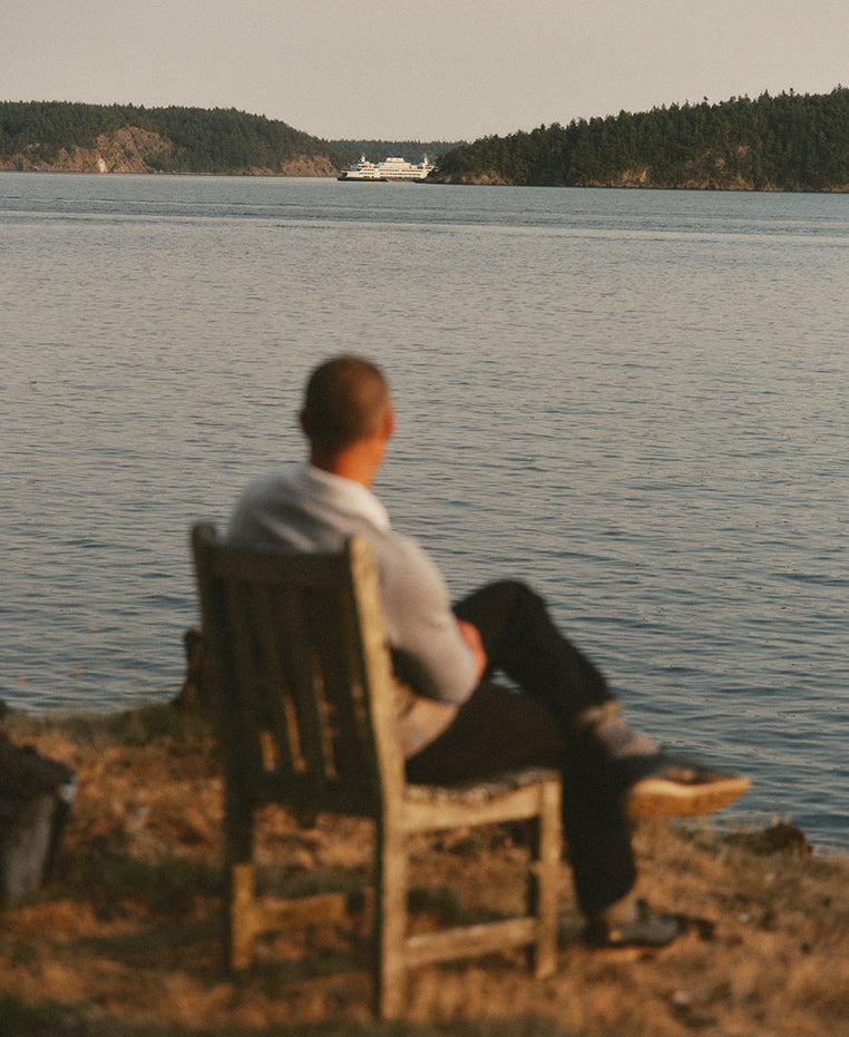 fit model sitting looking at the bay, by Taylor Stitch