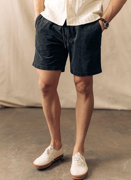 Model wearing The Apres Short in Heather Coal Pincord, by Taylor Stitch