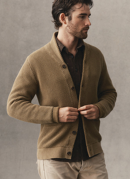 fit model posing in The Crawford Sweater in Bay Leaf, by Taylor Stitch