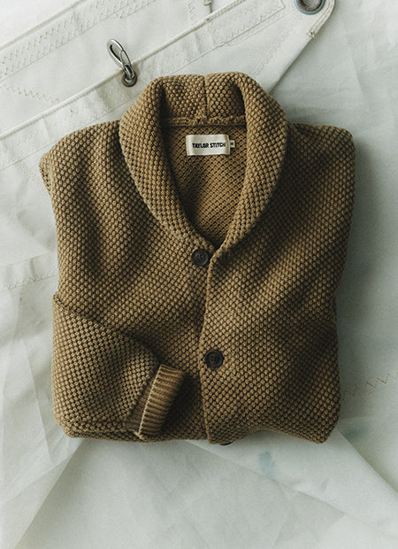 editorial flatlay of The Crawford Sweater in Bay Leaf, by Taylor Stitch