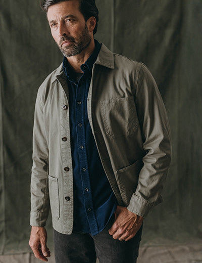 fit model posing in The Ojai Jacket in Smoked Olive Foundation Twill, by Taylor Stitch
