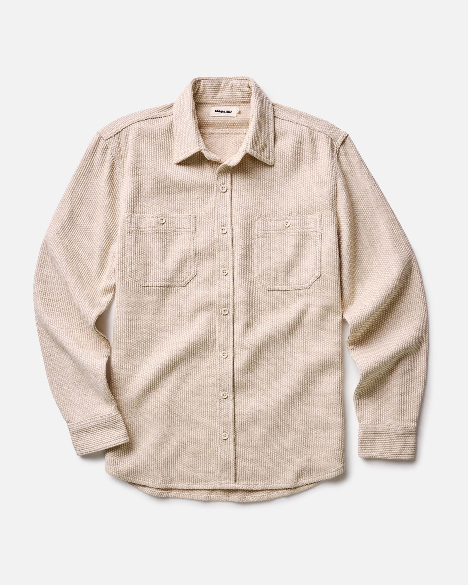 fit model leaning against the wall in The Utility Shirt in Natural Sashiko, Wovens by Taylor Stitch