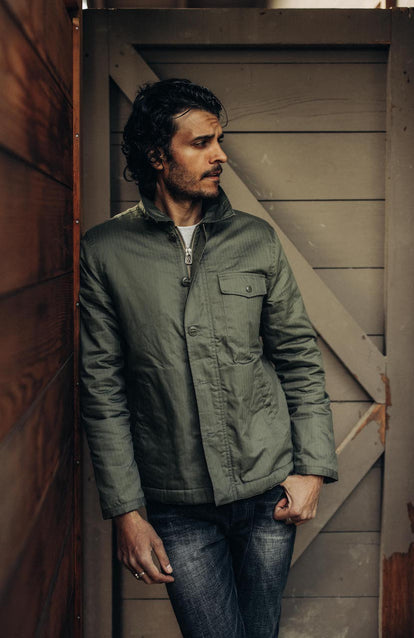 Model wearing The Lined Watts Jacket in Waxed Olive