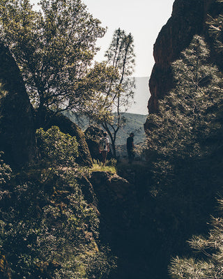 Two friends hiking a mountain trail in the great California outdoors